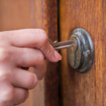 Locking the door.