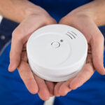 UPMC Mercy Burn Center Provides Free Smoke Detectors to Local Fire Departments Close-up Of Electrician Holding Smoke Detector