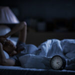 Medical Moment: Good Sleep is Key for Better Health Depressed young woman lying in bed cannot sleep from insomnia